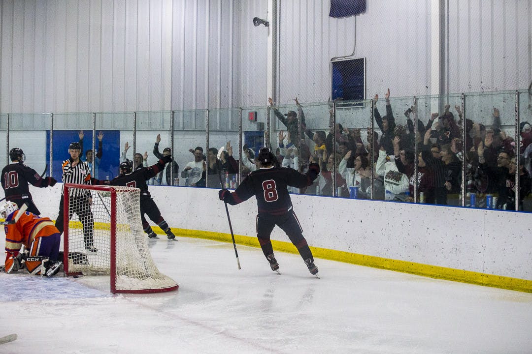 FILE—Freshman center Jake Puskar celebrates with fans after scoring a goal for South Carolina during the rivalry match against Clemson on March 3, 2023. The Gamecocks beat the Tigers 8-5.