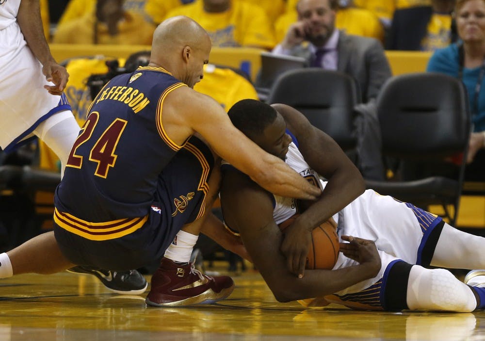 The Golden State Warriors' Draymond Green, right, fights for the ball against the Cleveland Cavaliers' Richard Jefferson (24) in the second quarter during Game 1 of the NBA Finals at Oracle Arena in Oakland, Calif., on Thursday, June 2, 2016. The Warriors won, 104-89. (Nhat V. Meyer/Bay Area News Group/TNS)
