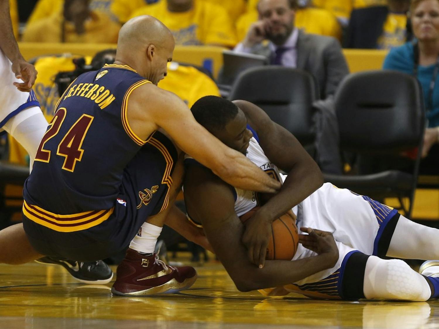 The Golden State Warriors' Draymond Green, right, fights for the ball against the Cleveland Cavaliers' Richard Jefferson (24) in the second quarter during Game 1 of the NBA Finals at Oracle Arena in Oakland, Calif., on Thursday, June 2, 2016. The Warriors won, 104-89. (Nhat V. Meyer/Bay Area News Group/TNS)