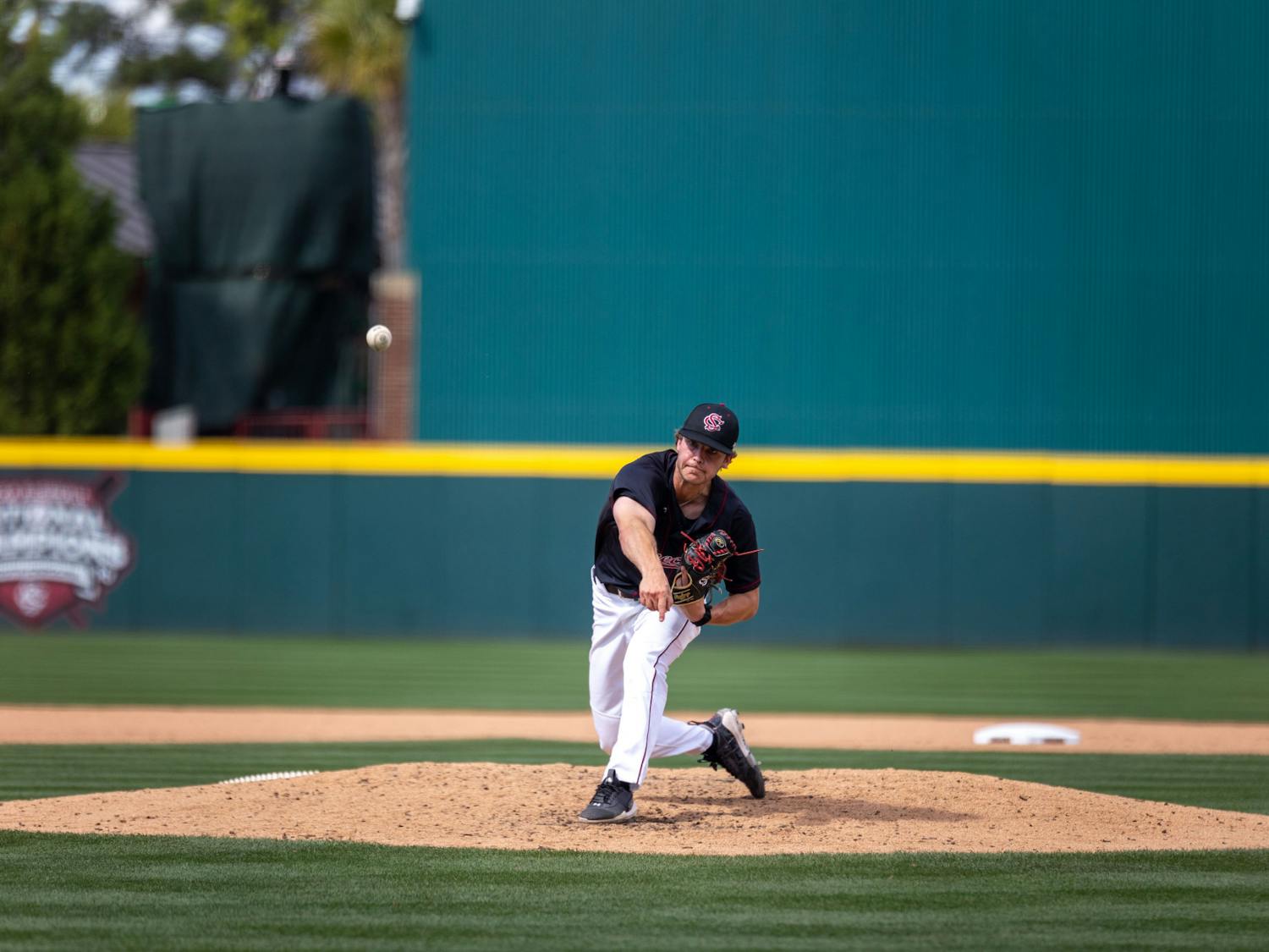 Redshirt junior pitcher James Hicks throws from the windup during the third game against the Gators at Founders Park on April 22, 2023. The Gamecocks swept all three games over the weekend, with the final game ending 7-5.