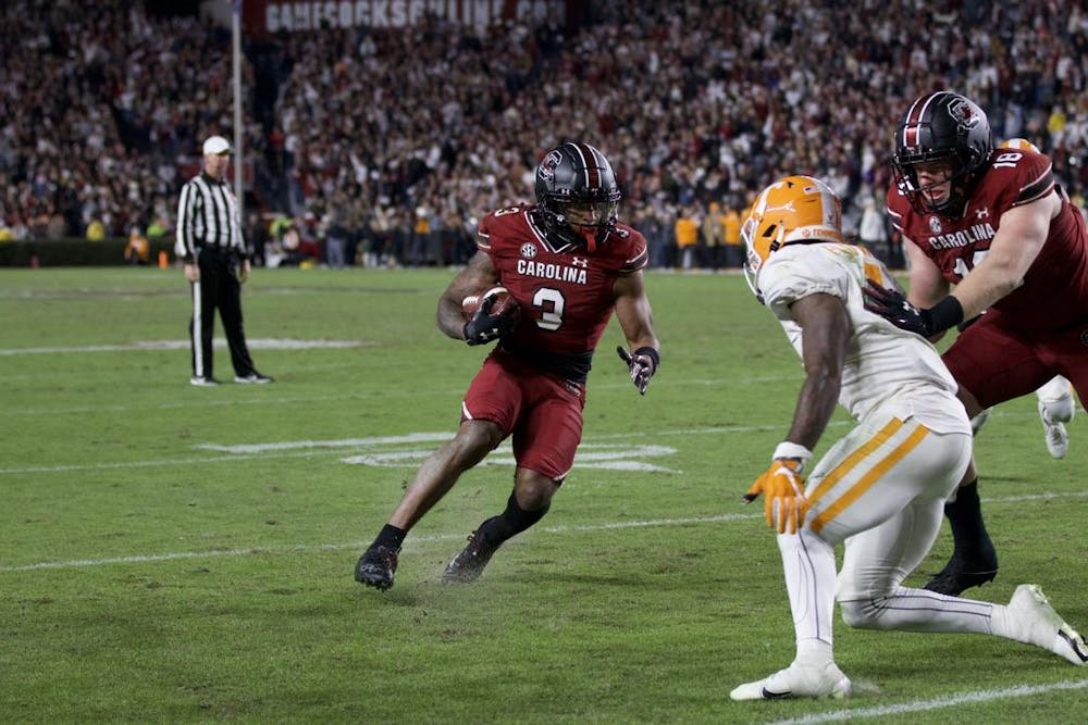 <p>FILE — Senior wide receiver Antwane Wells Jr. runs the ball into the end zone for a South Carolina touchdown, putting the Gamecocks up 42-31. Wells announced Sunday night that he will enter the transfer portal after two seasons with the Gamecocks.</p>