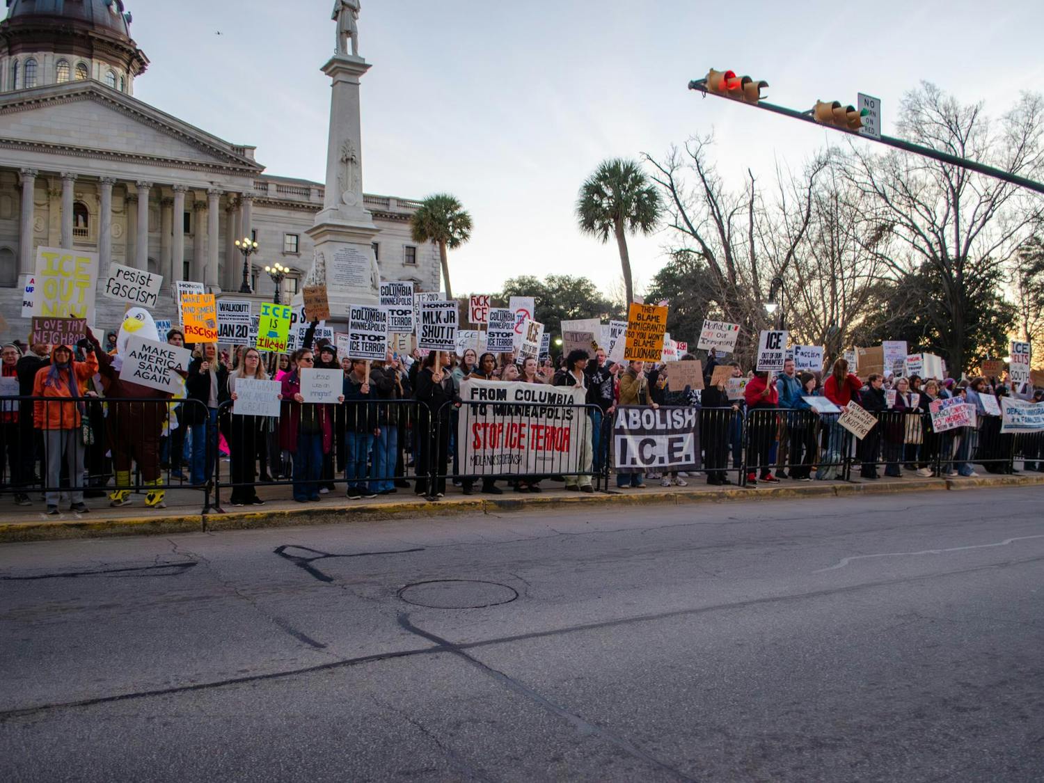 A crowd of protestors as seen from the street at the statehouse in Columbia, South Carolina, on Jan. 20, 2026. The protesters, a large number of whom are students, hold signs and banners opposing the actions of U.S. Immigration and Customs Enforcement.