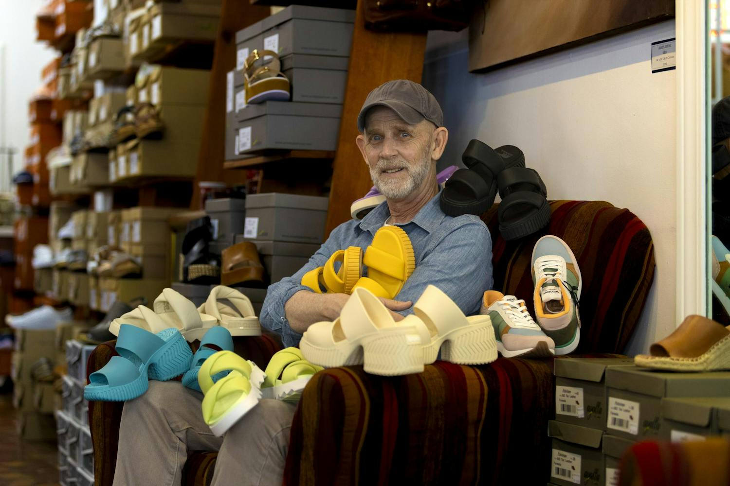 Columbia shoe store owner Kelly Tabor poses with Sorel goods in his store on April 10, 2024. Tabor owns Good for the Sole Shoes &amp; Accessories located at 728 Saluda Ave. in Five Points.