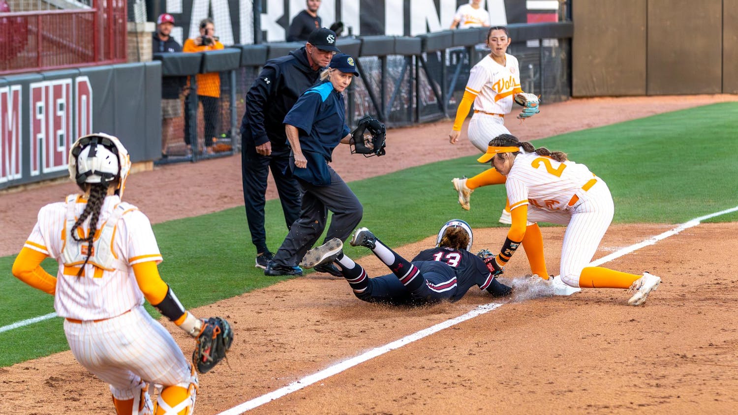 Senior infielder Zoe Laneaux (center) gets tagged out during a pickle between third and home base in the fourth inning of the match against the University of Tennessee at Beckham Field on March 24, 2024. The Volunteers beat the Gamecocks 7-0.