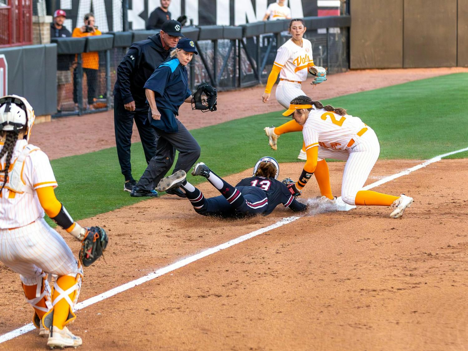 Senior infielder Zoe Laneaux (center) gets tagged out during a pickle between third and home base in the fourth inning of the match against the University of Tennessee at Beckham Field on March 24, 2024. The Volunteers beat the Gamecocks 7-0.