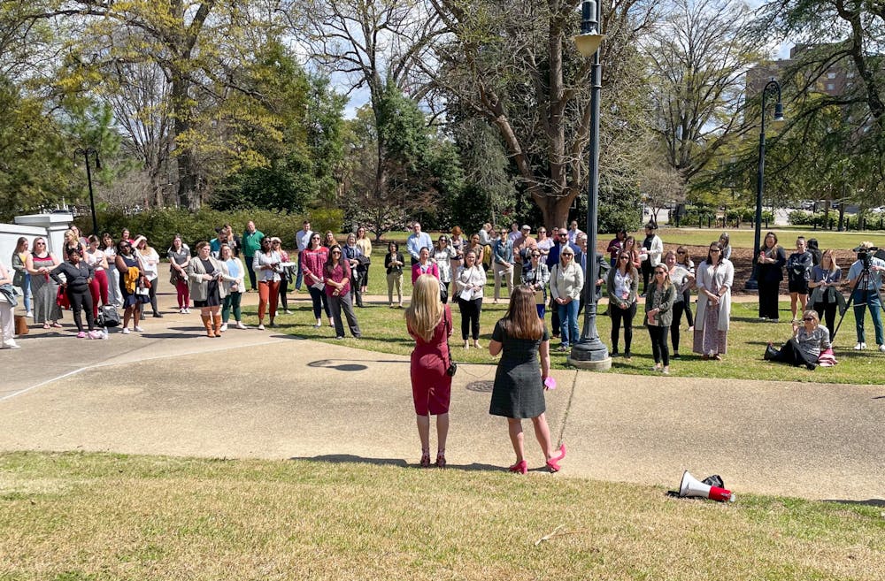 Representative Beth Bernstein (sponsor of H.3560) and Ashley Lidow (WREN) speak to UofSC employees gathered on the State House grounds in support of parental leave legislation.