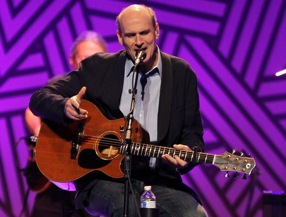 James Taylor performs in a concert at the Amway Center in Orlando, Fla., on Tuesday, Nov. 18, 2014. (Stephen M. Dowell/Orlando Sentinel/TNS)