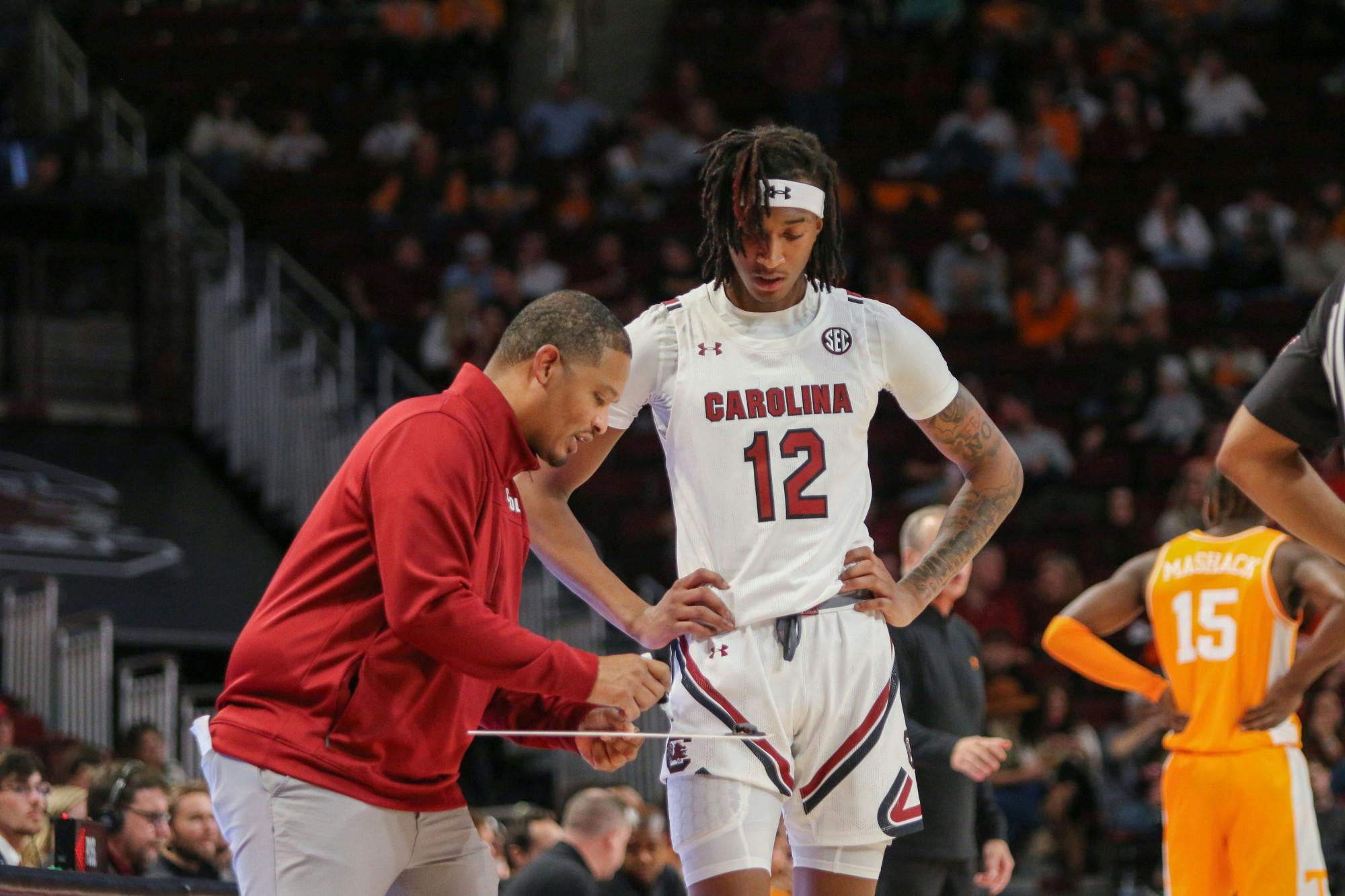 Freshman guard Zachary Davis gets instructions from head coach Lamont Paris on Jan. 7th, 2023. The Gamecocks lost to the Volunteers 85-42.
