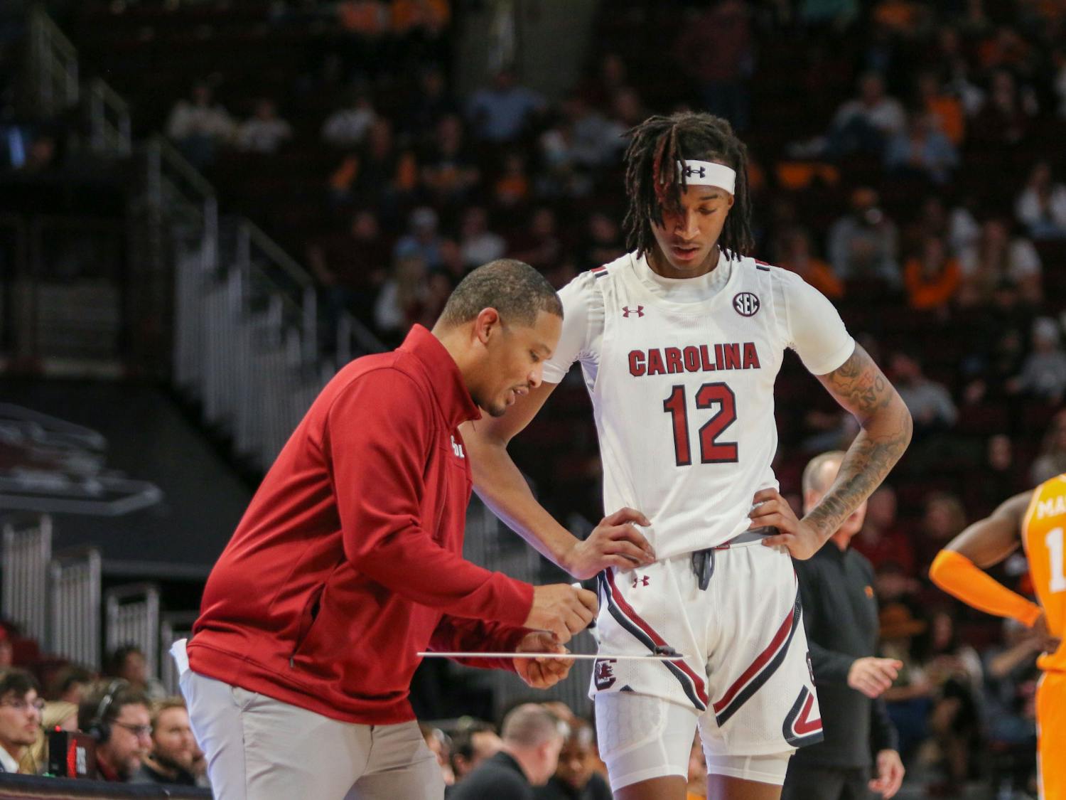 Freshman guard Zachary Davis gets instructions from head coach Lamont Paris on Jan. 7th, 2023. The Gamecocks lost to the Volunteers 85-42.