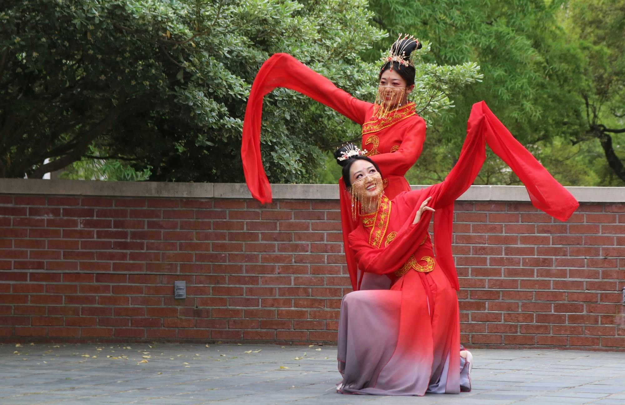 Students Xingze Zhao and Xinyu Zhang perform "The left-hand points at the moon," a traditional Chinese dance.