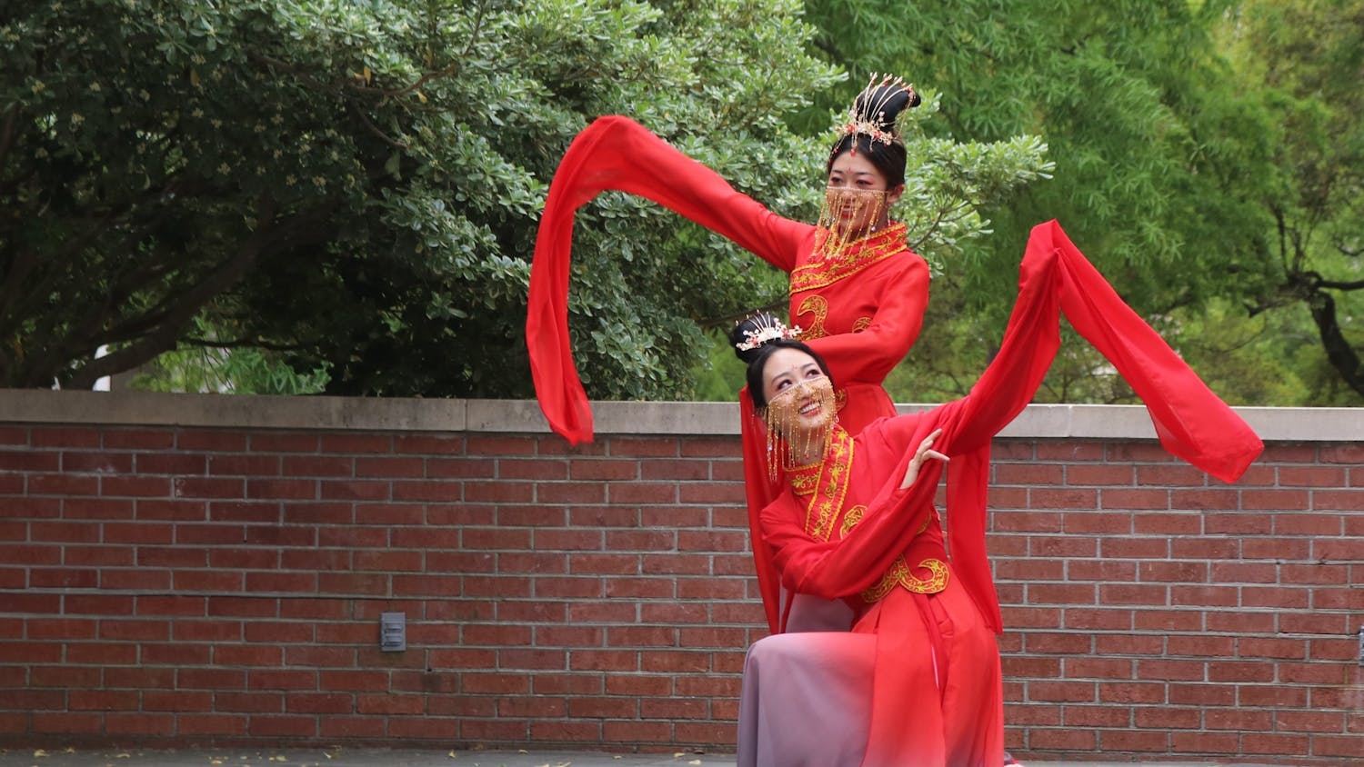 Students Xingze Zhao and Xinyu Zhang perform "The left-hand points at the moon," a traditional Chinese dance.
