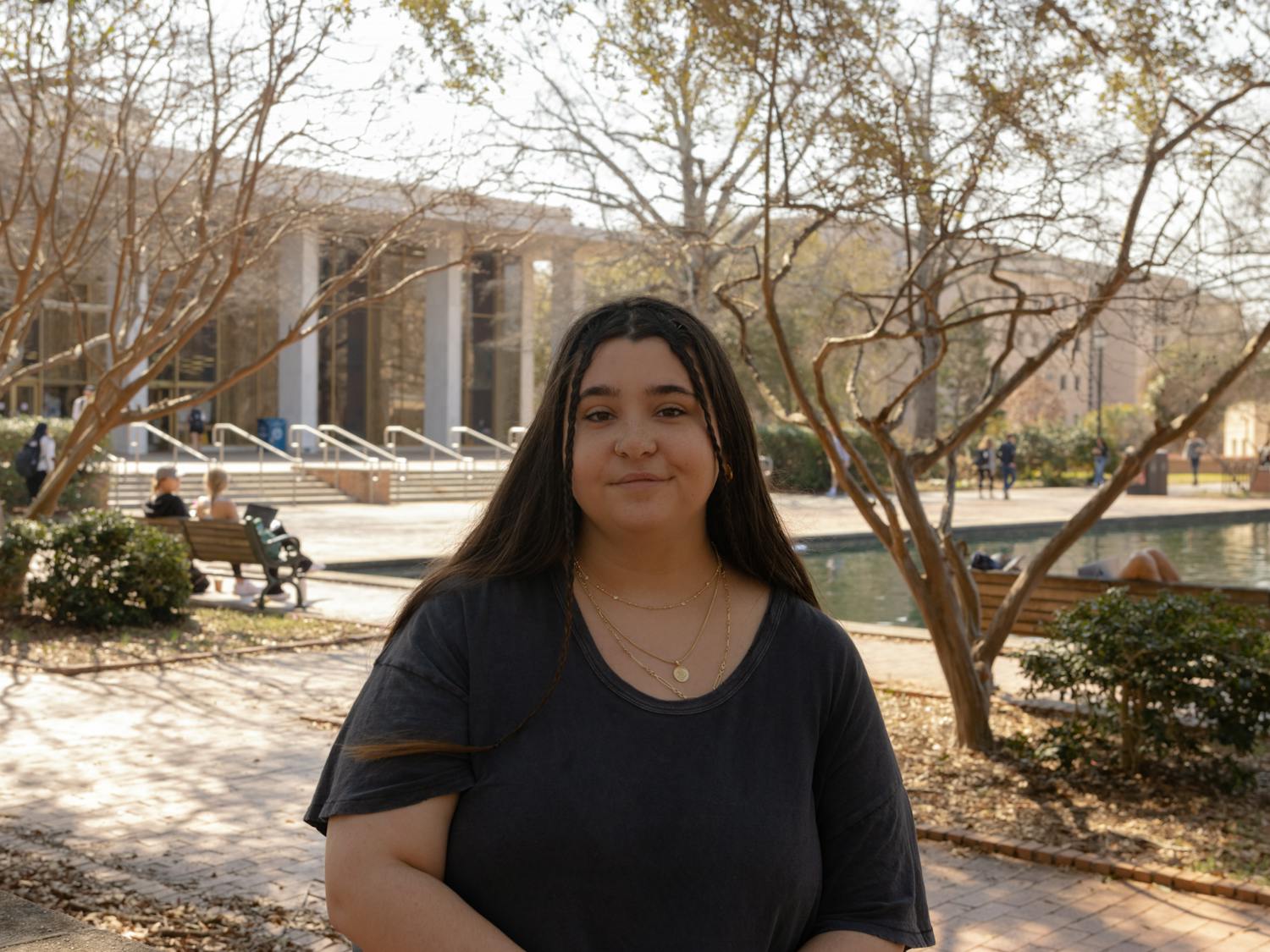 Julia Goulet, the opinion editor of The Daily Gamecock, poses in front of Thomas Cooper Library on Feb. 26, 2023. Goulet has struggled with her mental health for years and advocates for being able to be more open about personal struggles.&nbsp;