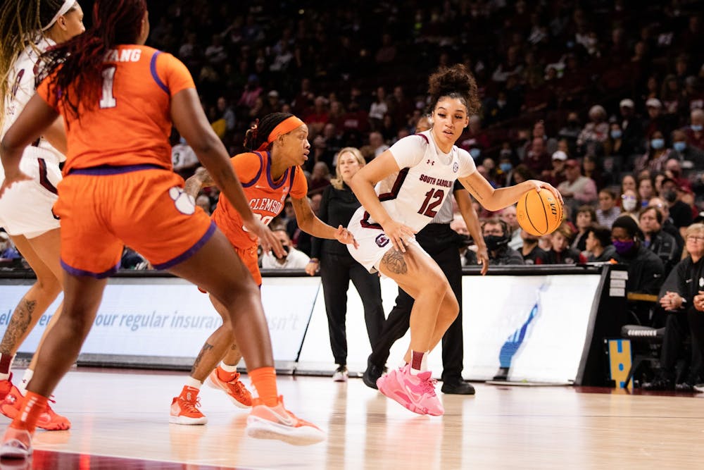 <p>Senior guard Destanni Henderson lunges for the ball in an attempt to keep possession against Clemson on Nov. 17, 2021.&nbsp;</p>