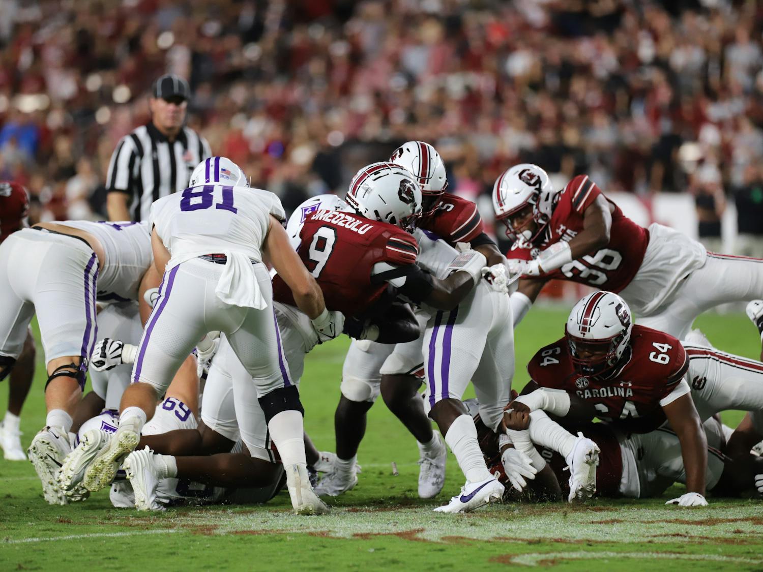 A group of South Carolina defenders, including freshmen linebackers Desmond Umeozulu and Grayson "Pup" Howard, swarm to one of Furman's running backs in the third quarter. Both young Gamecocks got their first significant action in the game and combined for seven total tackles.
