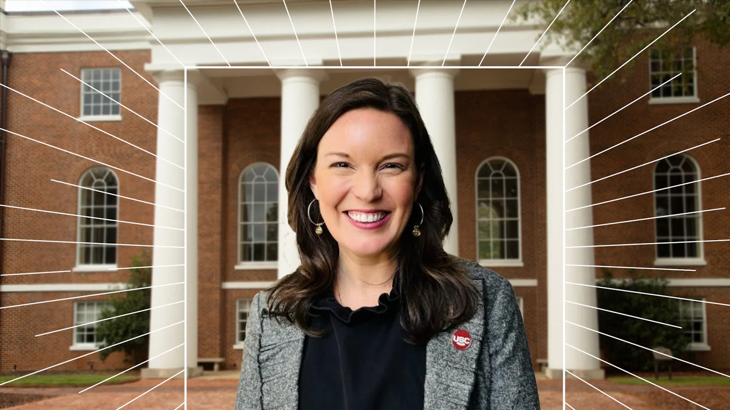 A portrait of Ambra Hiott in front of a brick building with a white square-framed sunburst around her.