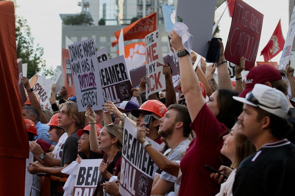 <p>FILE - University of South Carolina fans cheer at ESPN College GameDay on Sept. 2, 2023. Fans started lining up early in the morning to secure a spot on the barricade.</p>