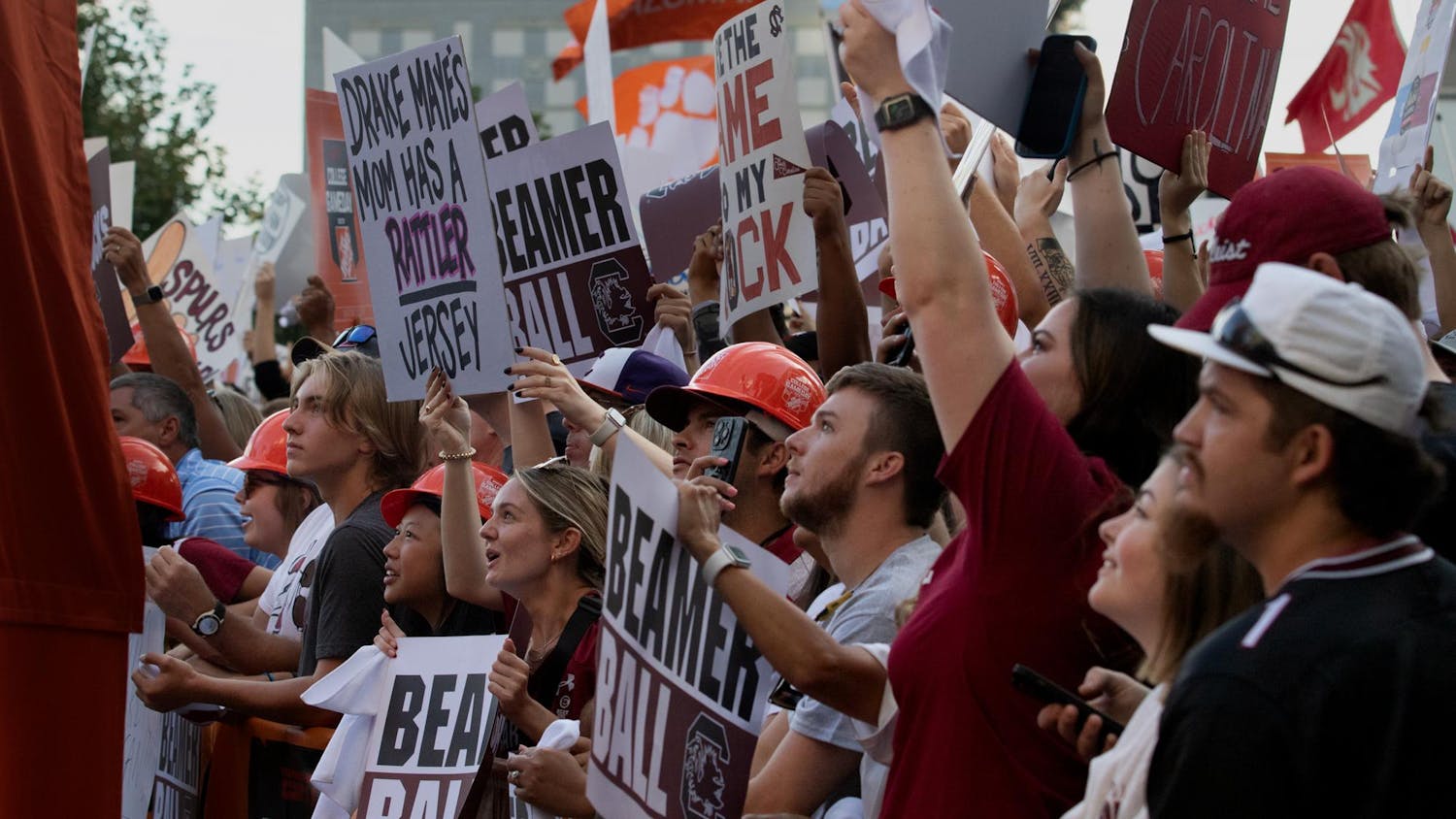 FILE - University of South Carolina fans cheer at ESPN College GameDay on Sept. 2, 2023. Fans started lining up early in the morning to secure a spot on the barricade.