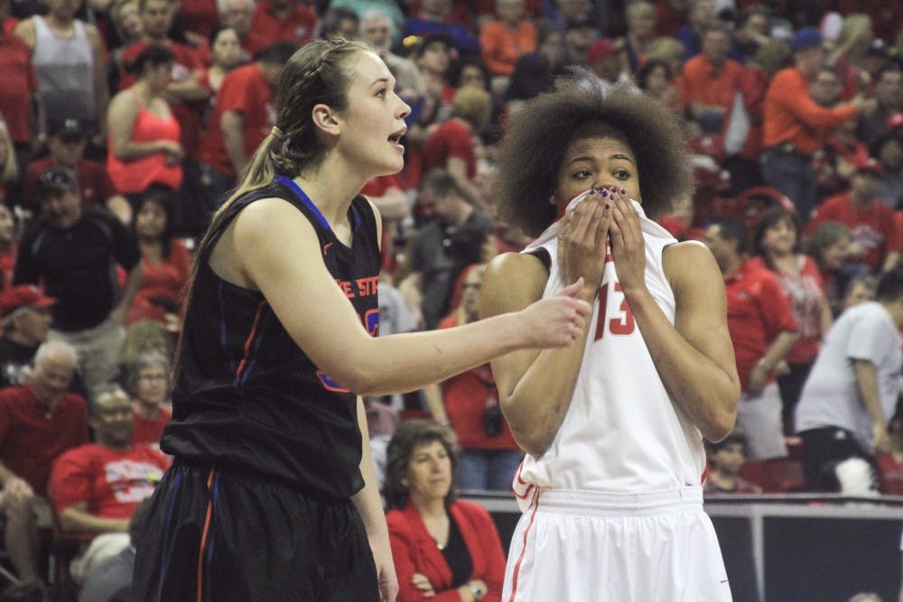 New Mexicos Khadijah Shumpert wipes her face as she and Boise States Miquella Askew await a free throw attempt during the second half of the Mountain West Basketball Championship game Friday afternoon at the Thomas & Mack Center in Las Vegas, Nevada.
