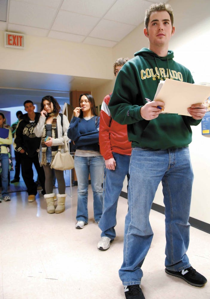 Sophomore Tim Wilcox waits in line at the University College Advisement Center on Wednesday for a meeting with an academic adviser. Peer adviser Noel Rodriguez said the wait was about 30 minutes to an hour.