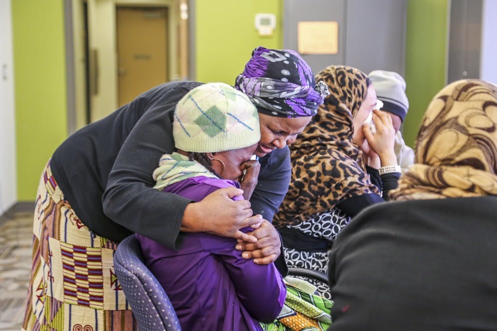 Nkazi Sinandile&nbsp;embraces Emerane-Imata a refugee from Democratic Republic of the Congo on Wednesday afternoon at PB&J Family Services. Sinandile&nbsp;has helped many immigrants and refugees throughout her time at PB&J Family Services.