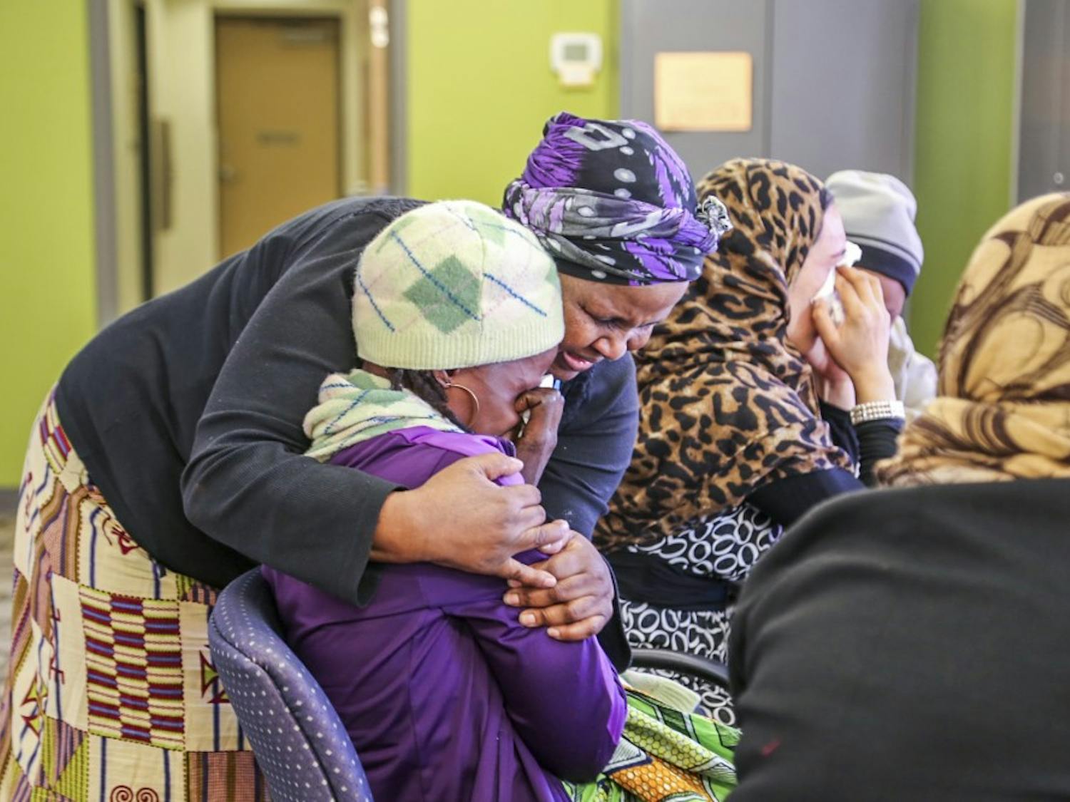 Nkazi Sinandile embraces Emerane-Imata a refugee from Democratic Republic of the Congo on Wednesday afternoon at PB&J Family Services. Sinandile has helped many immigrants and refugees throughout her time at PB&J Family Services.