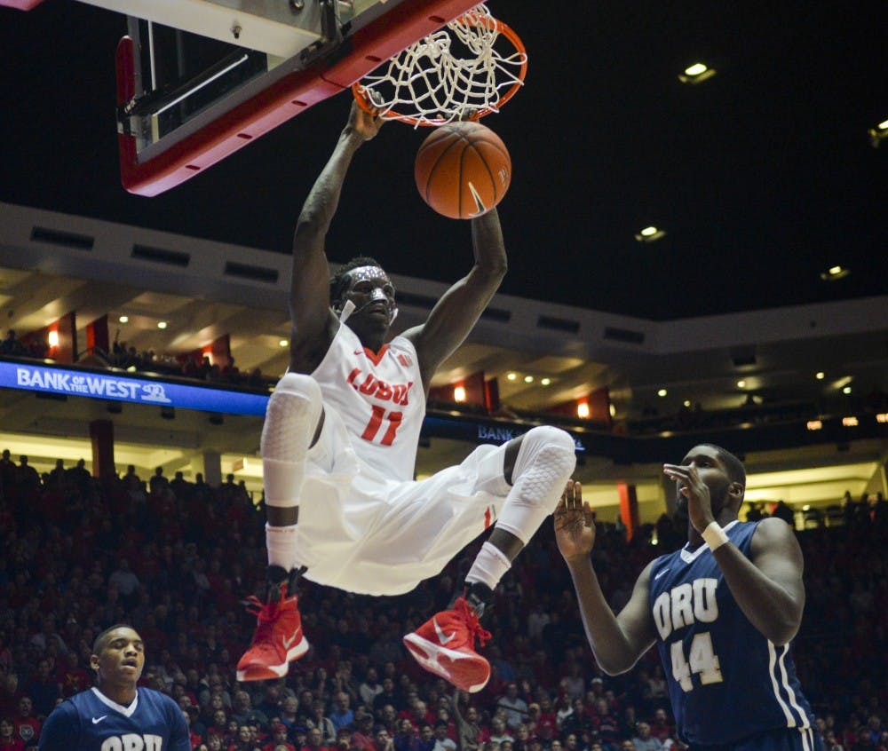 Junior center Obij Aget&nbsp;hands on after a dunk at WisePies Arena Dec. 1. The Lobos will play Northern Iowa this Saturday at 7 p.m..