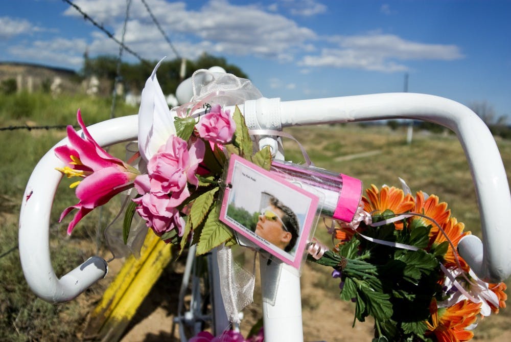 	A memorial in honor of cyclist John Anczarski is mounted beside State highway 124 near the Laguna Pueblo. The 19-year-old cyclist was killed while riding his bike across the country to promote breast cancer awareness. 