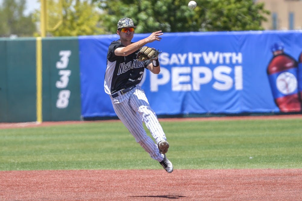 Junior infielder Justin Bridgman throws the ball to first base to out the a Air Force runner Saturday afternoon at Santa Ana Star Field. Nevada beat Air Force in the seventh inning 12-1 and will advance to play the Lobos at 5 p.m. at Santa Ana Star Field.
