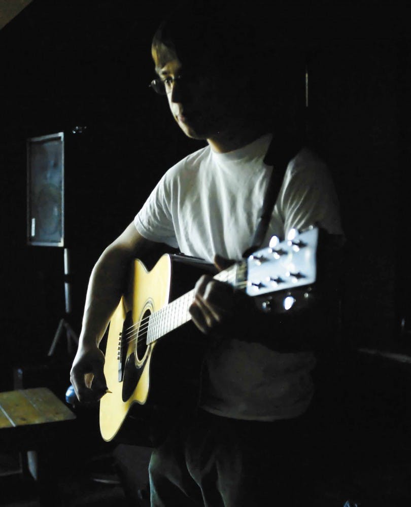 Stephen Perry sings a song at the Blue Dragon Caf