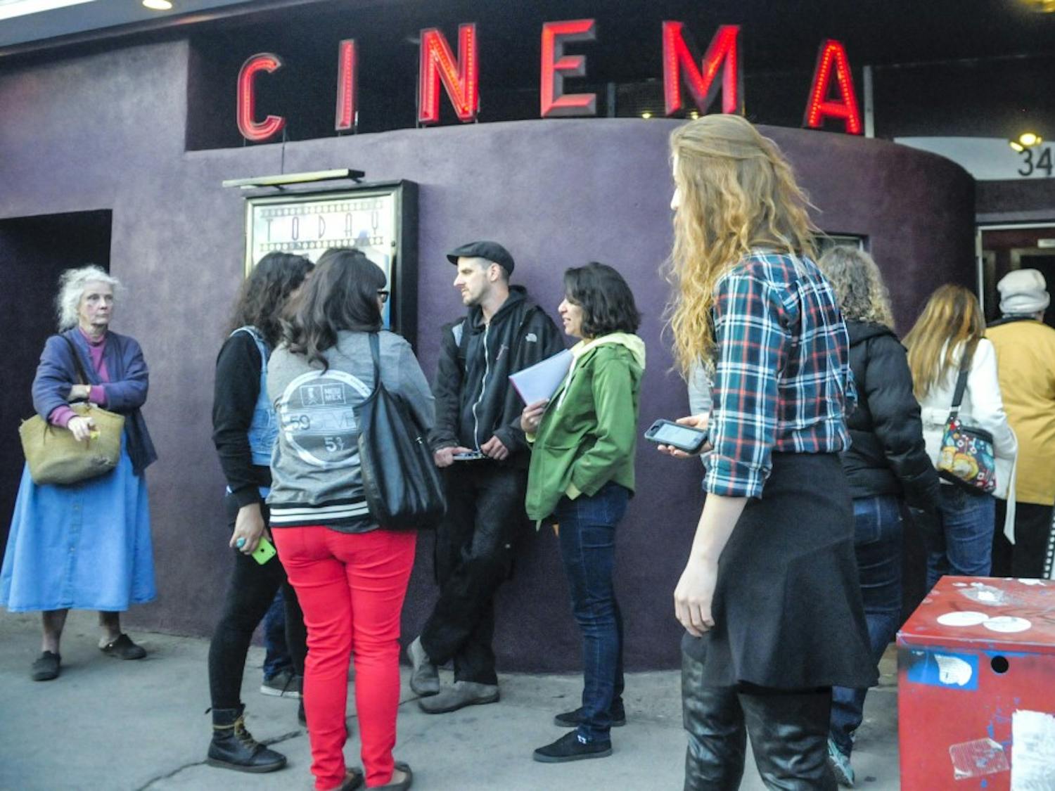 A group of people wait in front of the Guild Cinema to view series of films shown during the Sin Fronteras film festival Saturday. The films focused on social issues as well as artistic qualities in Latin America. 