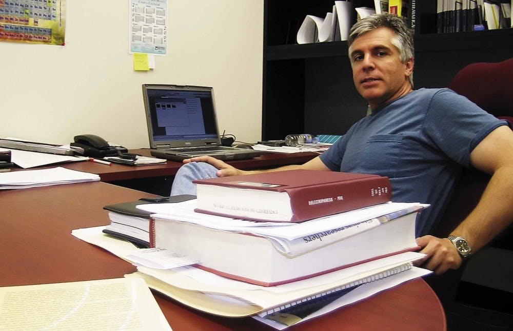 Dimiter Petsev, an assistant professor in chemical and nuclear engineering, talks about his development of a research technique in his office in the Ferris Engineering Center on Thursday.