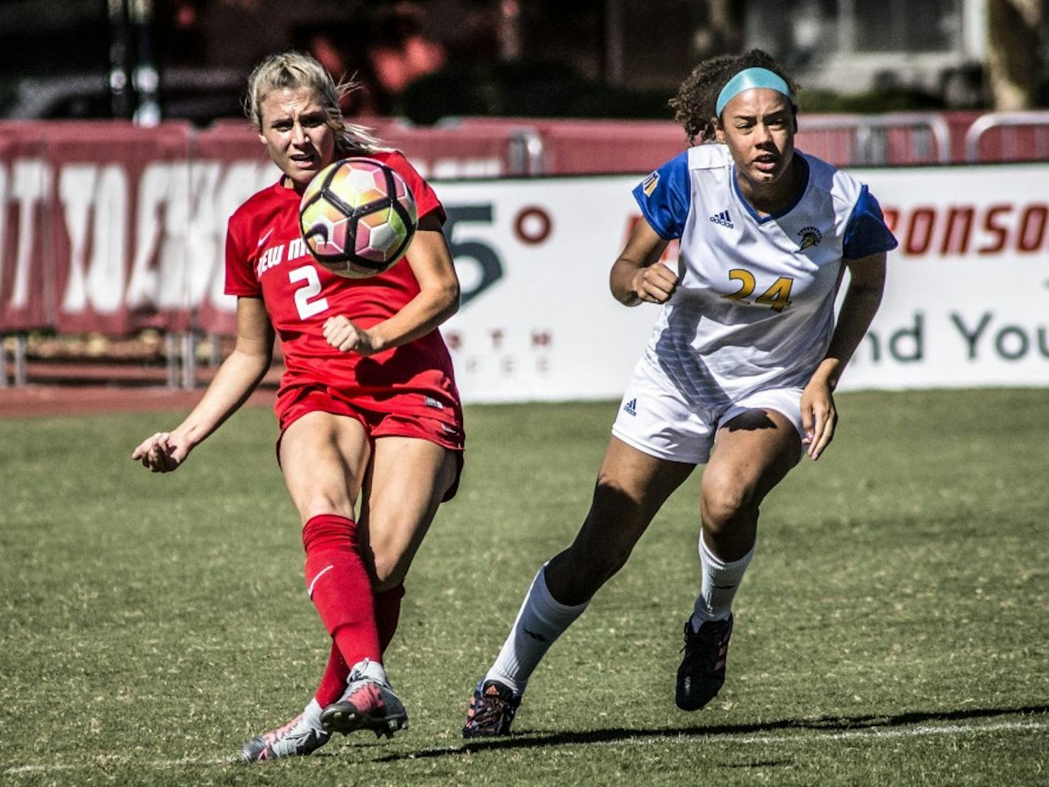 Jessica Nelson clears the ball as Kiara Parker of San Jos? State University contests at the UNM Soccer Complex on Oct. 8, 2017. UNM fell short with a 1-2 loss against SJSU.