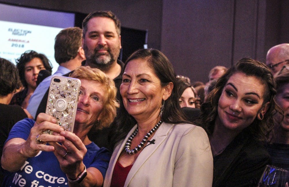 Deb Haaland and her daughter Somah (right) pose for a photo with supporters after winning the race for the 1st Congressional District Tuesday, Nov. 6.