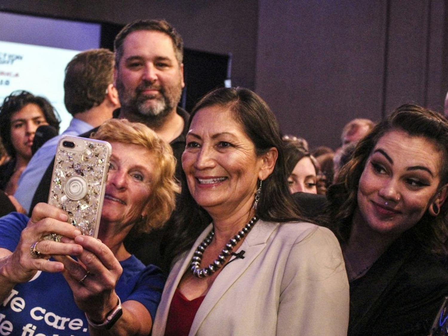 Deb Haaland and her daughter Somah (right) pose for a photo with supporters after winning the race for the 1st Congressional District Tuesday, Nov. 6.
