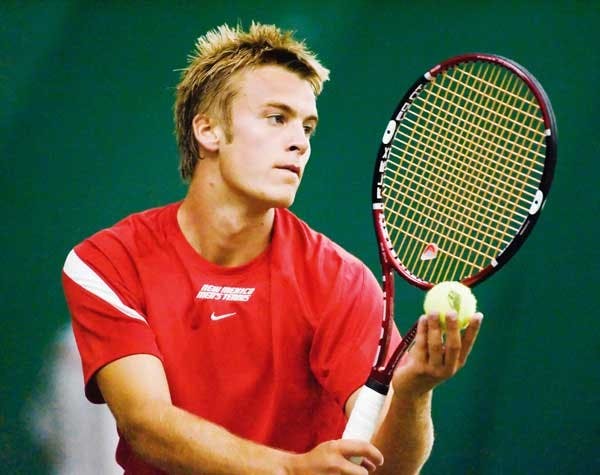 UNM's Miles Bugby prepares to serve to NMSU's Jim Brouleau during the New Mexico Balloon Fiesta Invitational on Sunday at the UNM Tennis Complex. 