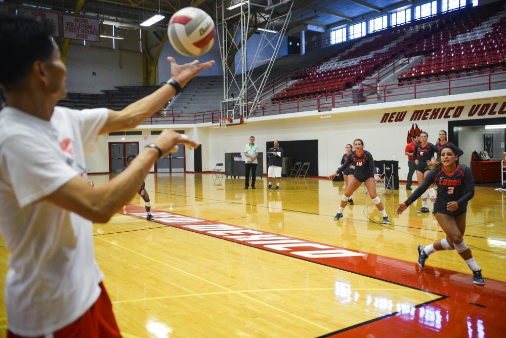 Volunteer volleyball coach Gitaik Hong passes the ball to players randomly during a drill at Johnson Gym. The Lobos will have their first exhibition of the fall 2016 season Saturday August 20, 2016.&nbsp;