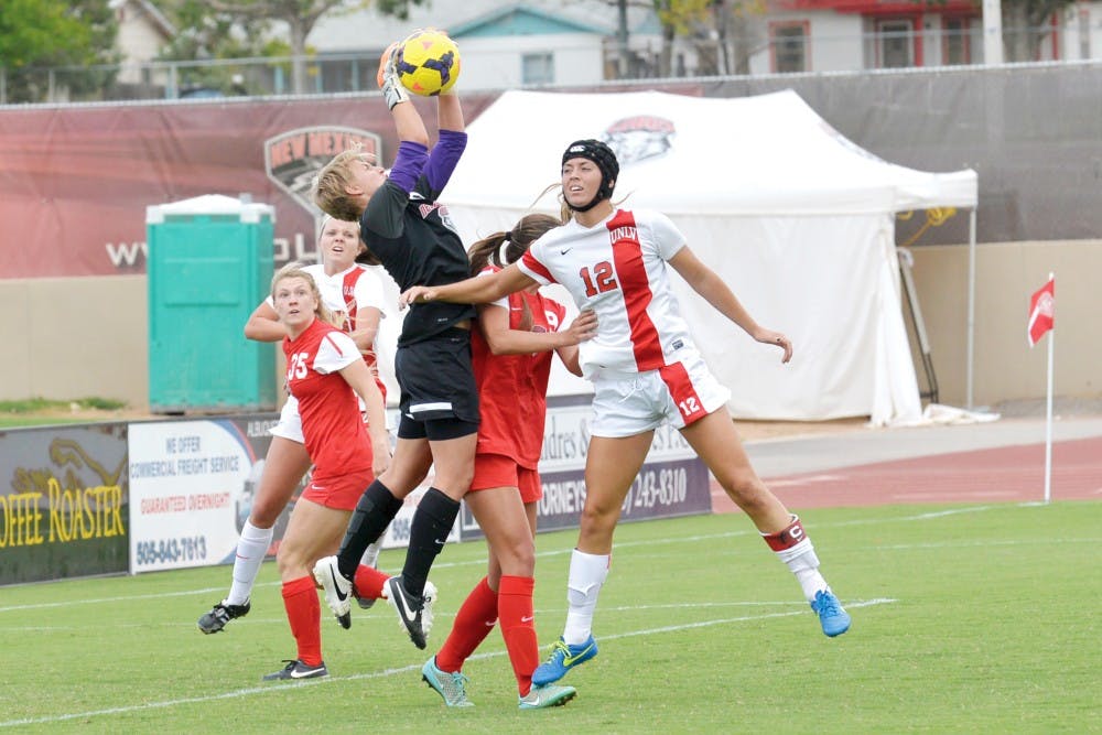 Lobo goalkeeper Cassie Ulrich grabs the ball away from UNLV’s offense during their game on Sunday. UNM is on the road playing Wyoming October 9.