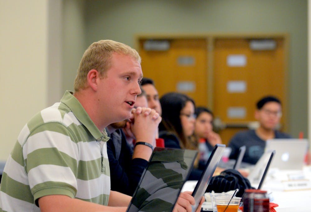 Senator Ryan Boyle speaks at ASUNM’s last senate meeting Wednesday Nov. 18. Boyle proposed a piece of legislation that would support students' ability to bring pepper spray on campus.