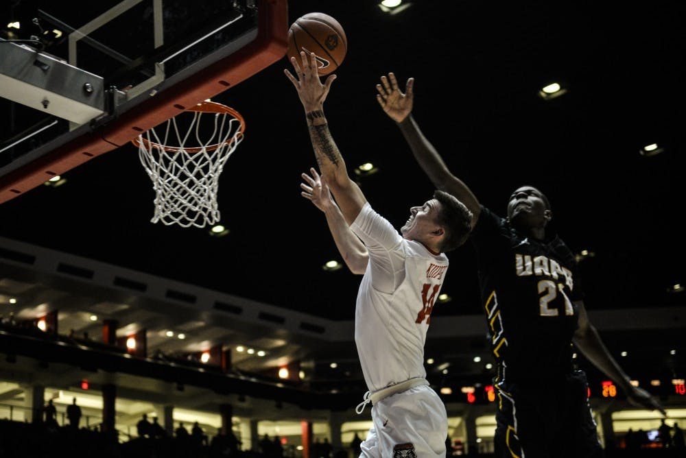 Sophomore guard Dane Kuiper leaps up to the net while playing against Arkansas-Pine Bluff Saturday, Dec. 17, 2016 at WisePies Arena. 