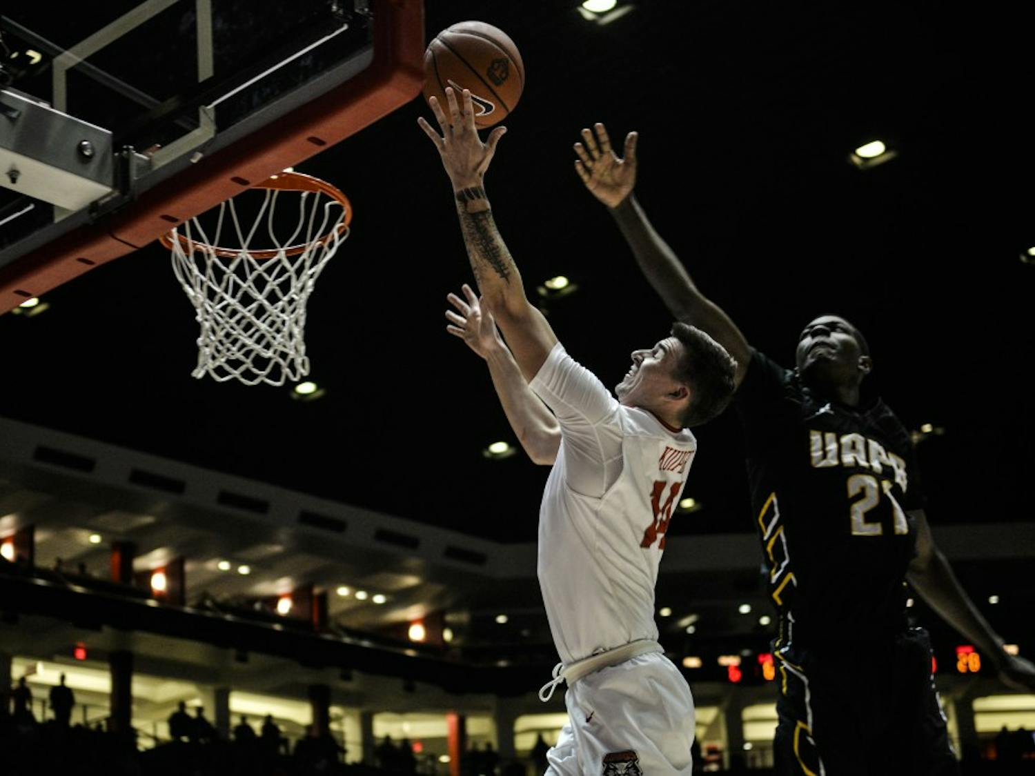 Sophomore guard Dane Kuiper leaps up to the net while playing against Arkansas-Pine Bluff Saturday, Dec. 17, 2016 at WisePies Arena. 