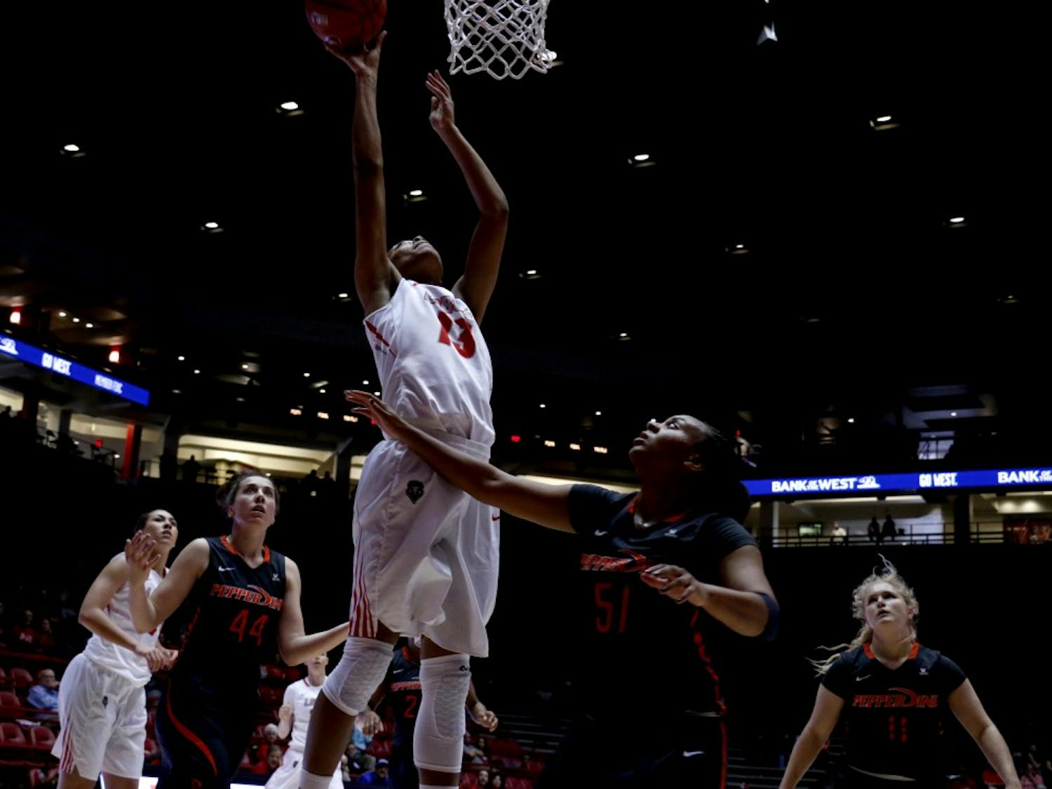 Senior forward Khadijah Shumpert leaps for a lay up at WisePies Arena Saturday afternoon. The Lobos beat Pepperdine 60-52.