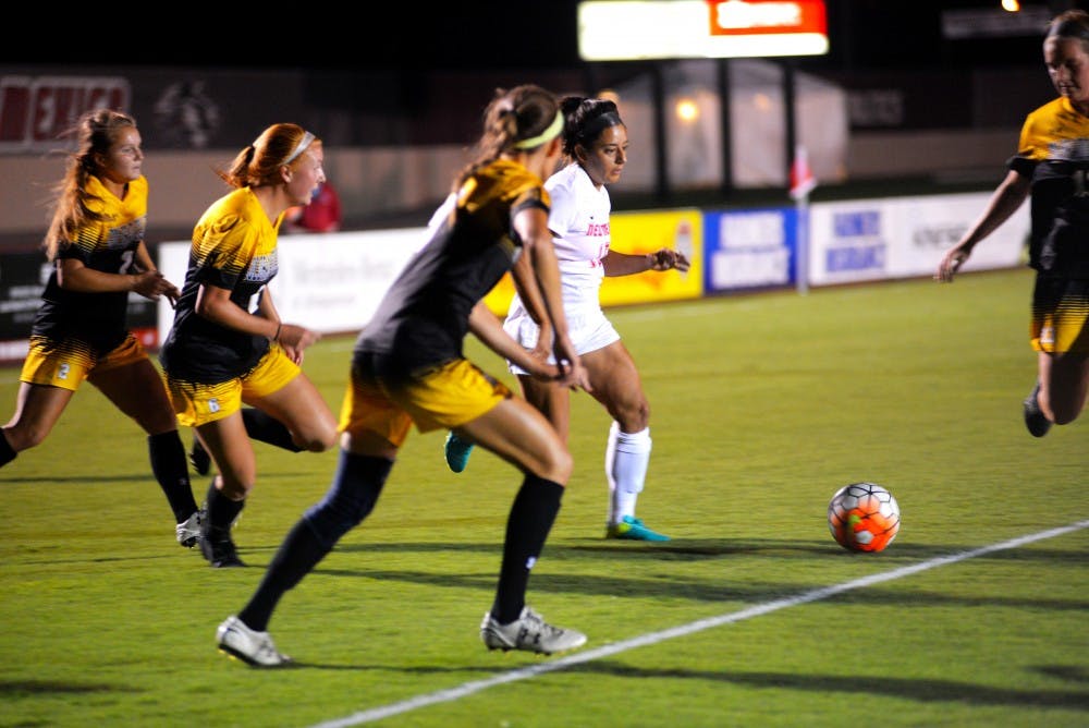 Lobos senior defender&nbsp;Olivia Ferrier works to get the ball away from a swarm of Colorado College players on Friday, Sept. 23, 2016 at the UNM Soccer Complex. The Lobos lost to Colorado College 1-0 to open Mountain West play.&nbsp;