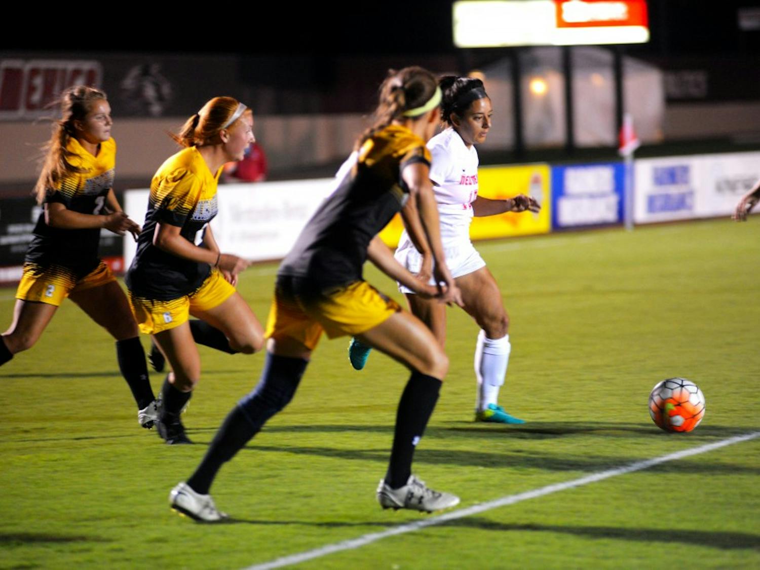 Lobos senior defender&nbsp;Olivia Ferrier works to get the ball away from a swarm of Colorado College players on Friday, Sept. 23, 2016 at the UNM Soccer Complex. The Lobos lost to Colorado College 1-0 to open Mountain West play.&nbsp;