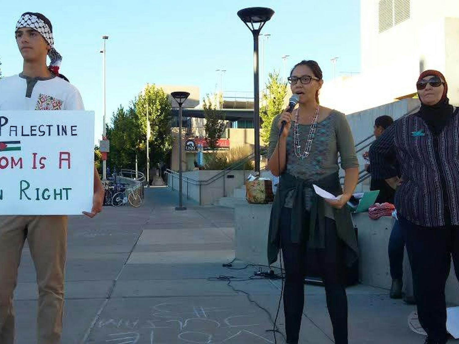 Saeed Assed (left), Melanie Yazzie (center) and Samia Assed participate at a Student Justice in Palestine organized demonstration in front of the UNM BookStore Oct. 14, 2015. A recent letter was sent to President Bob Frank in regards to cutting funding from the Muslim Student Association and Student Justice in Palestine student groups.