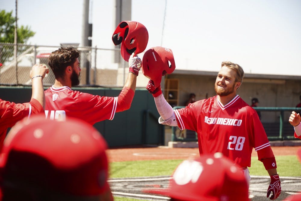 Jack Zoellner is meet by teammates  Danny Collier after hitting a 3-run homerun against UNLV on Saturday 4/21.