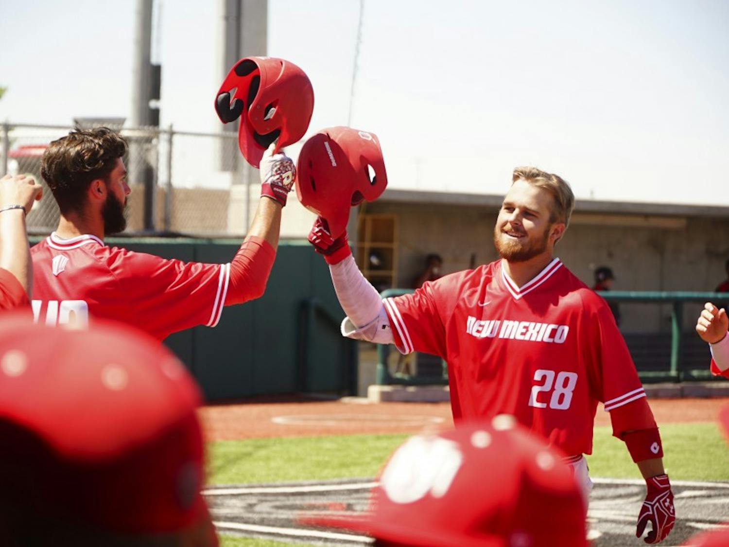 Jack Zoellner is meet by teammates  Danny Collier after hitting a 3-run homerun against UNLV on Saturday 4/21.
