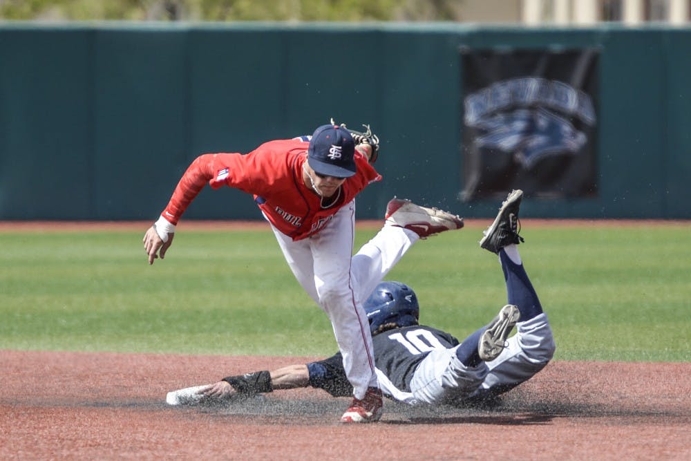 Junior short stop&nbsp;Miles Mastrobuoni slides past a Fresno State player to second base Friday afternoon at Santa Ana Star Field. Nevada beat Fresno State 25-6.&nbsp;