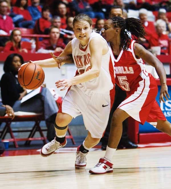 UNM's Amy Beggin dribbles past Nicholls State's Nikina Hill in the second half of Friday's game at The Pit. Beggin was named the Albuquerque Midtown Tournament's Most Valuable Player. 