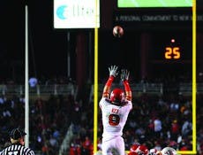 Utah's Aiona Key blocks James Aho's 41-yard field goal attempt. The blocked kick was the difference in the game, as the Lobos lost 13-10. 