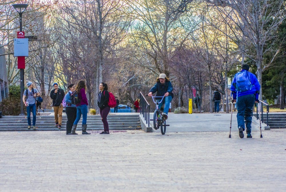 UNM community members congregate at Smith Plaza on Tuesday, Feb. 8, 2017.